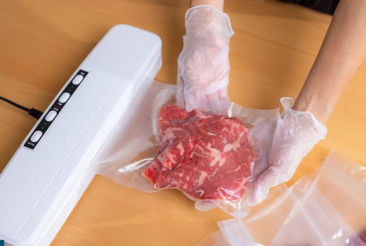 https://www.conserve-energy-future.com/wp-content/uploads/2023/06/raw-meat-getting-sealed-in-shrink-wrap.jpg